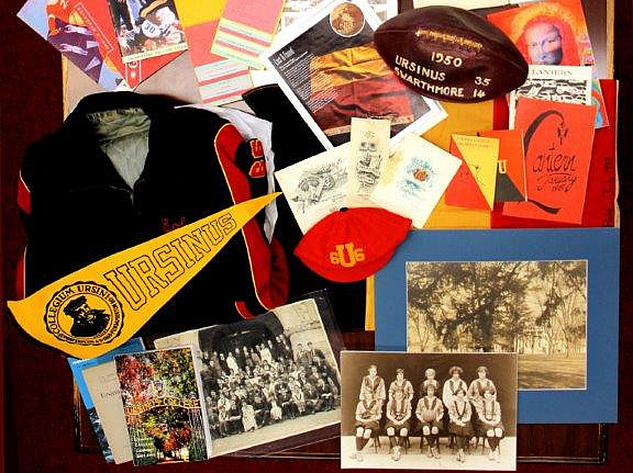 Photo of a collection of older Ursinus College photos, merch, and prints.