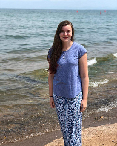 Megan McTaggart standing on a beach