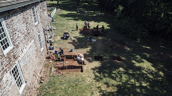 Students and faculty do an archeological dig by the Speakers House in Trappe. July 11, 2024 - Drone Shots