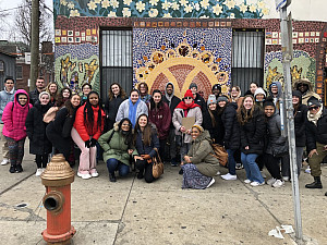 Ursinus students, faculty and staff on a walking tour of the Fairhill neighborhood and its murals.