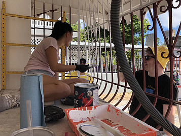 Isabel Wesman '23 and Miles Noecker '22 painting exterior