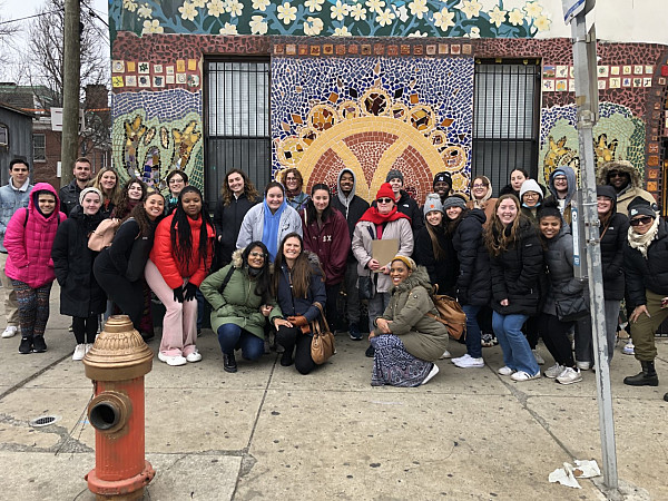 Ursinus students, faculty and staff on a walking tour of the Fairhill neighborhood and its murals. 