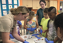 Mya Knappenberger '23 works with campers at Orion Communities