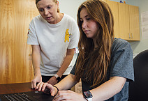 Student working along side her mentor to perform research in the TRACE lab.