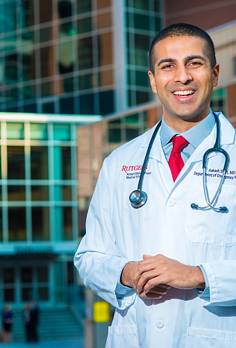 Dr. Aakash Shah poses for a photograph outside Robert Wood Johnson Hospital.