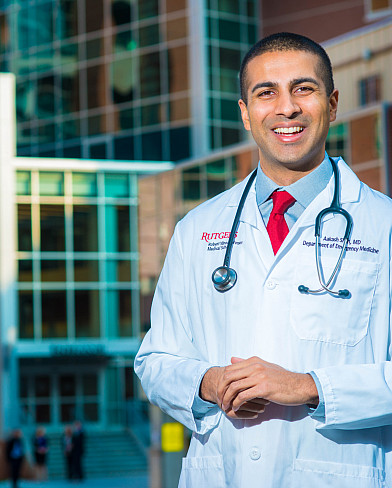 Dr. Aakash Shah poses for a photograph outside Robert Wood Johnson Hospital.