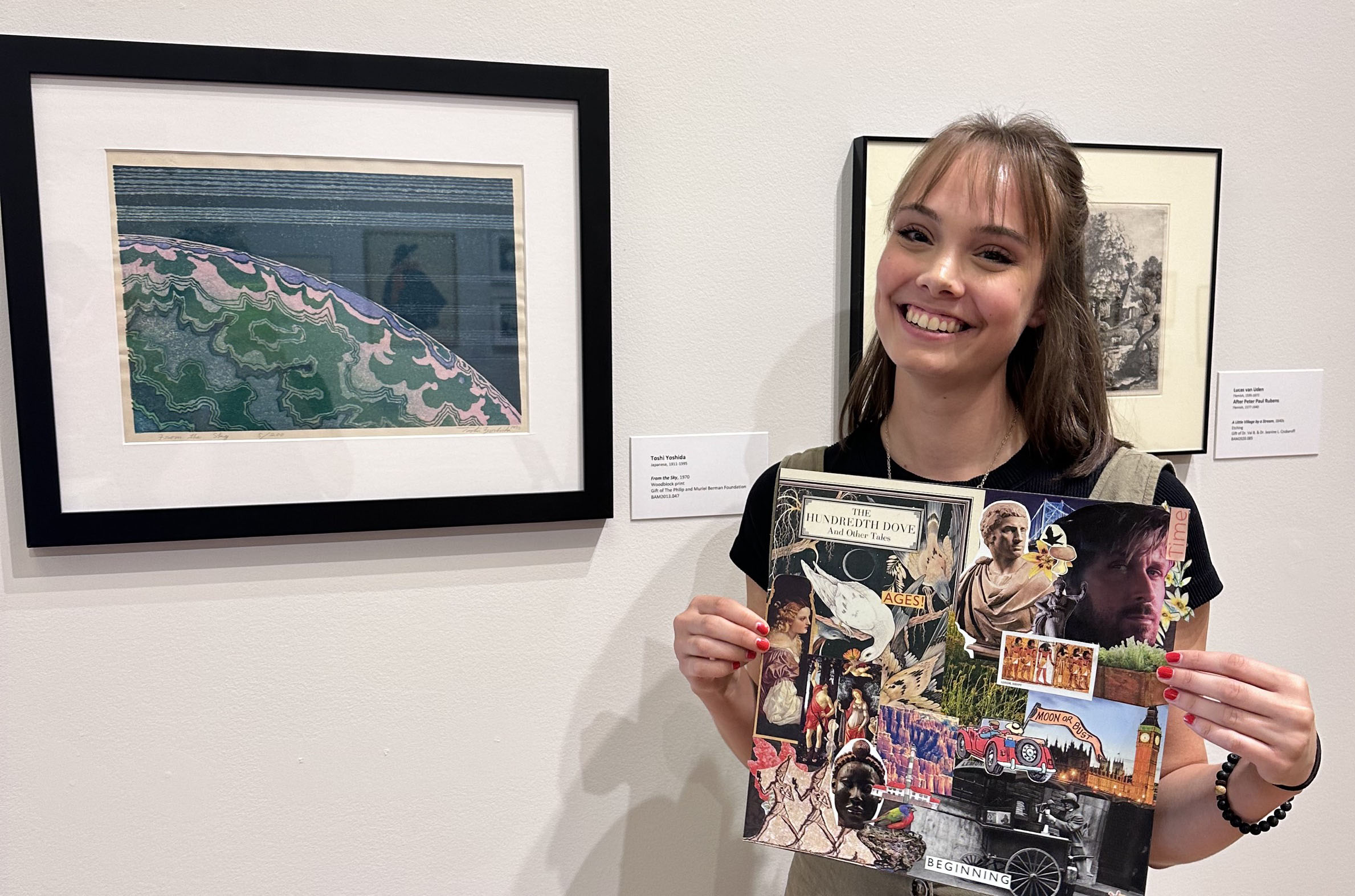 Ella Scalese smiling with her collage at a Berman craft event.