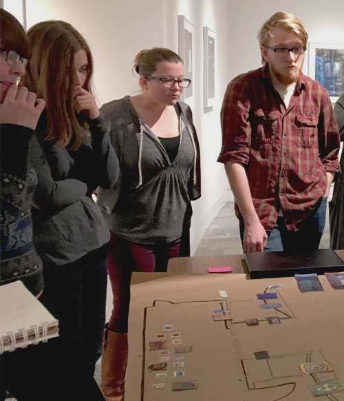 Curatorial Practices Seminar 2016 students looking at a gallery model.