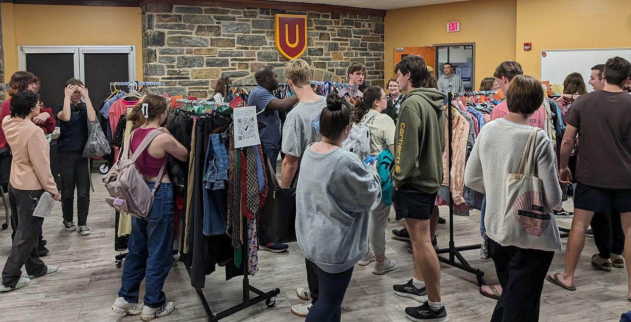 Students shopping for clothes at BearShare pop-up.