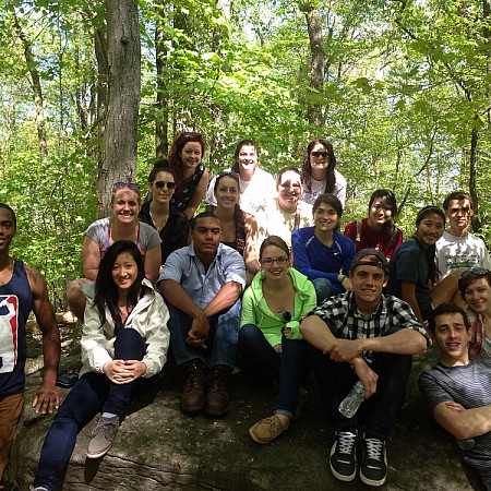Group of students on a field trip in the woods.