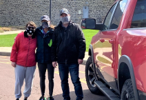 Tiffini and her parents picking up the 3D printers from UC
