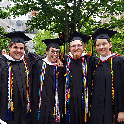 Recent History majors celebrating at commencement-and just look at all the honor cords!