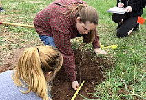 Students in Professor Katharine Davis's Introduction to Forensic Anthropology class spend a lab outdoors.