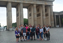 Ursinus students on the Economies in Transition study abroad trip stand in front of the Brandenburg Gate in Berlin.