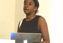 Chelsey Thomas presenting her work on first-generation immigrants in higher education
