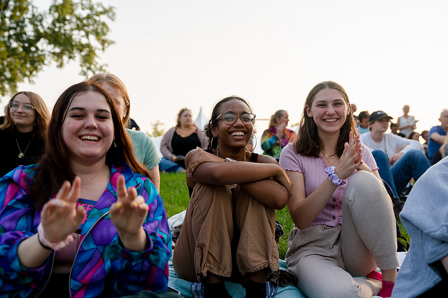 Students enjoying a performance on the Berman Museum lawn.