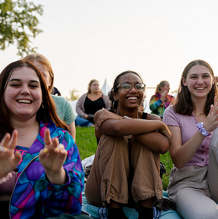 Students enjoying a performance on the Berman Museum lawn.