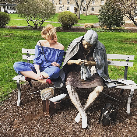 posing with sculptures
