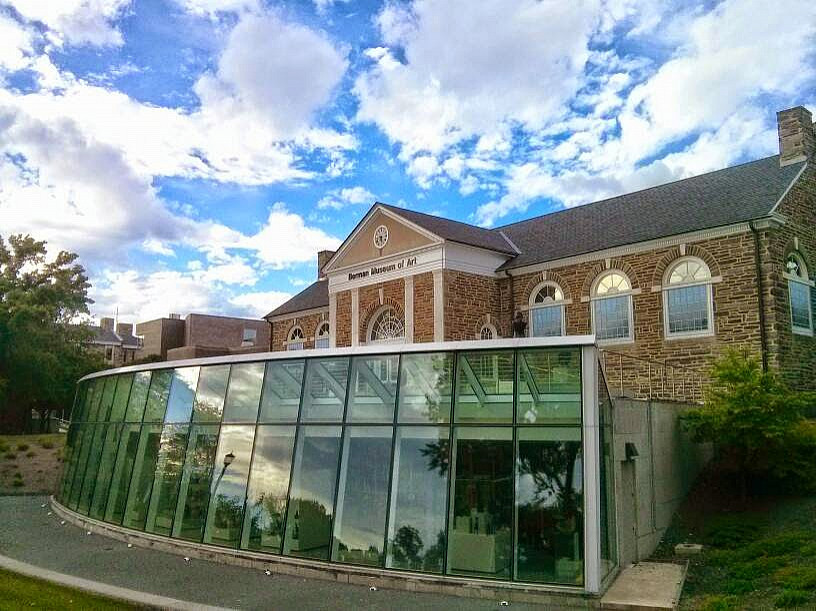 Berman Museum of Art captured against, and reflecting, a baby blue sky in early September
