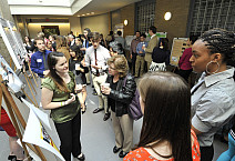 Students describe their scholarly work during CoSA 2014.