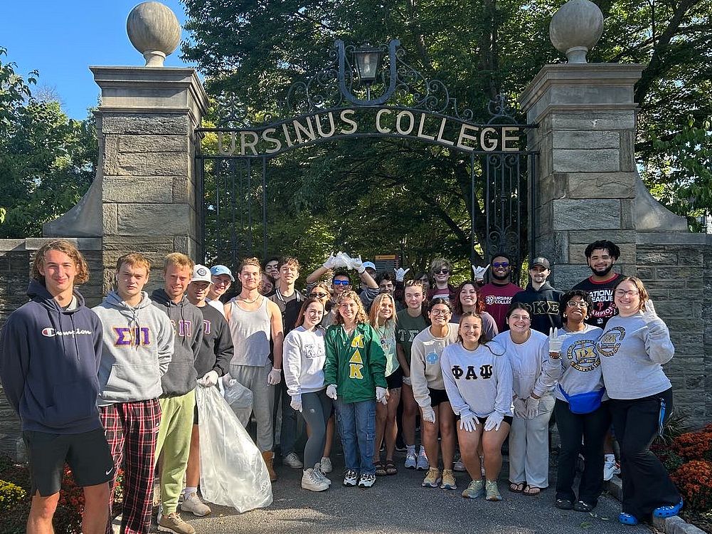 Ursinus College Greek organizations clean up Main Street as a collective service project.
